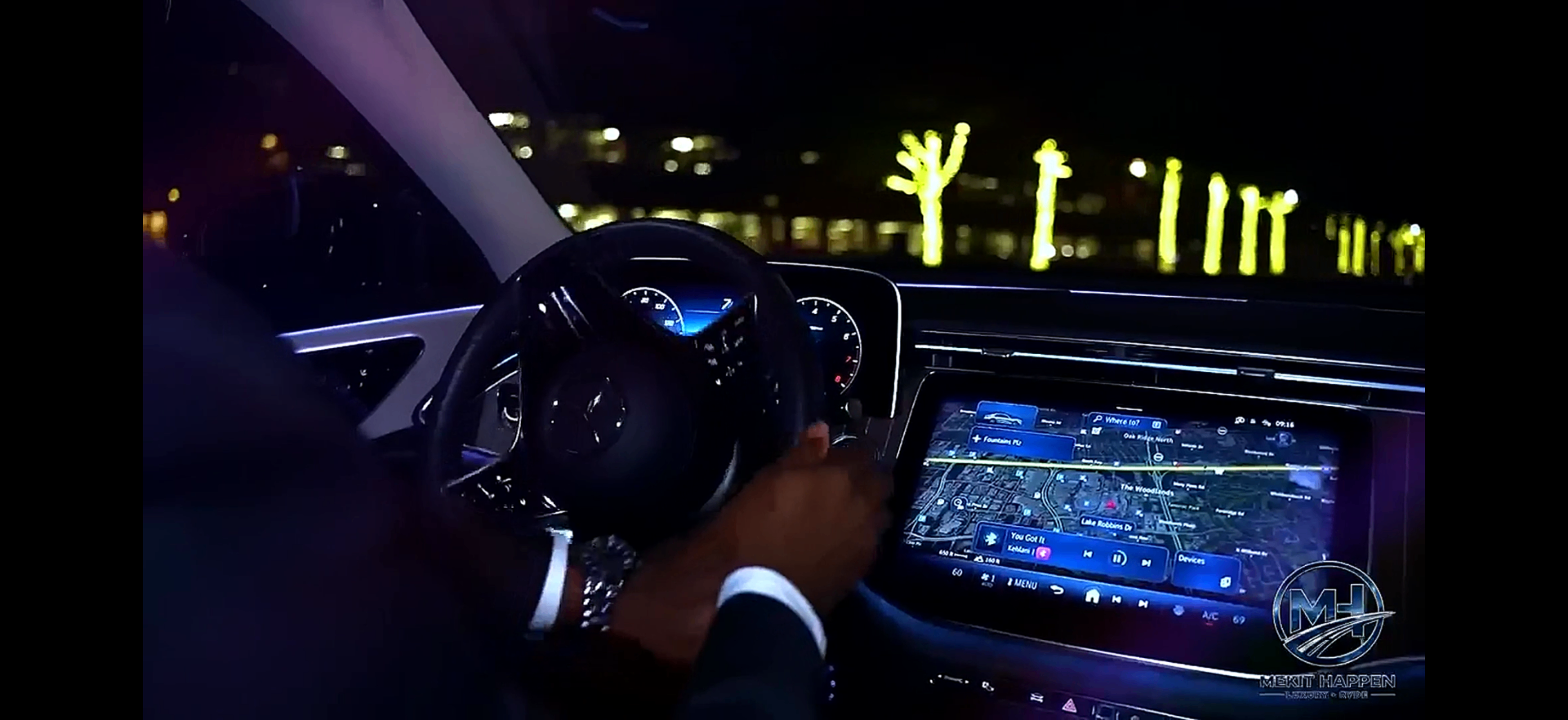 Mercedes-Benz E-Class interior at night with ambient lighting